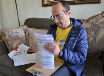 volunteer holding flyers