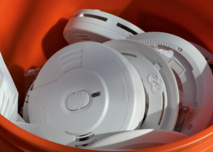 bucket of smoke alarms