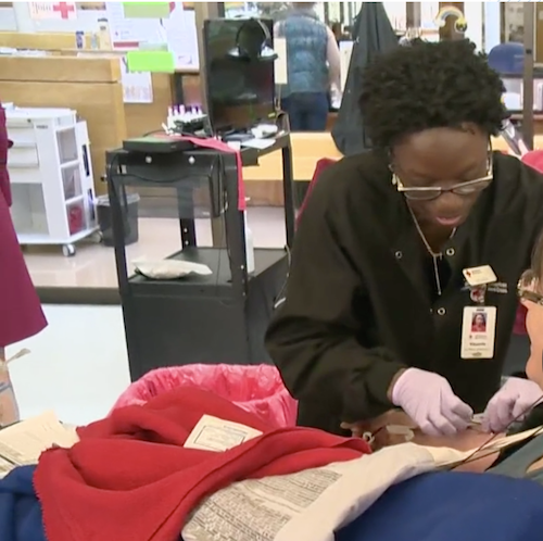 Phlebotomist working with a blood donor