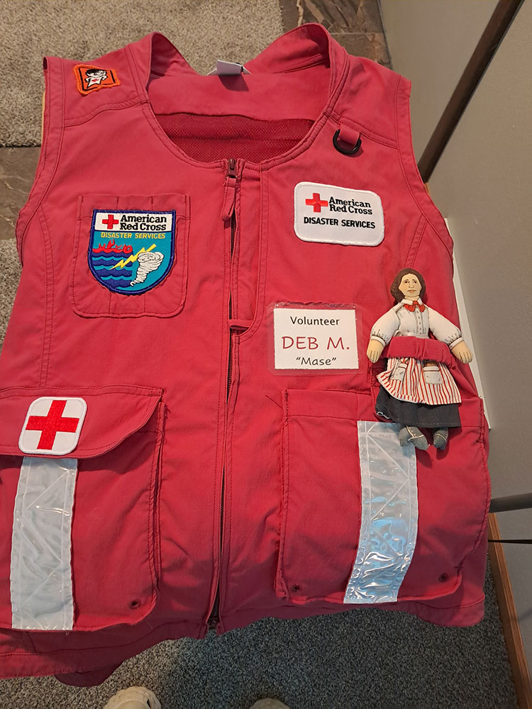 Flat Clara doll on Red Cross vest.