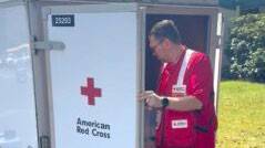 Red Cross volunteer John Himes checks inside of a Red Cross trailer.