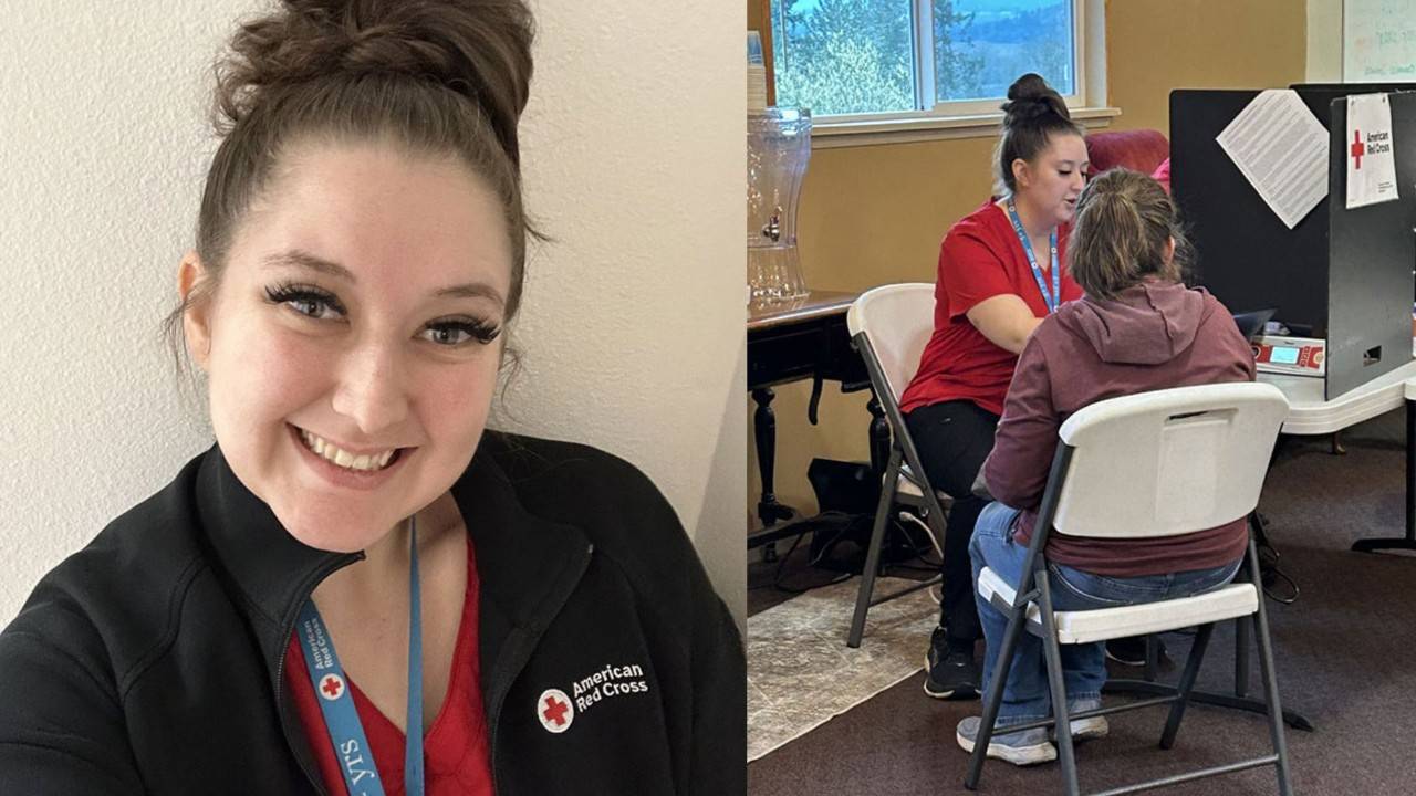 Brianna Buchanan wearing a Red Cross jacket and lanyard, takes a selfie.