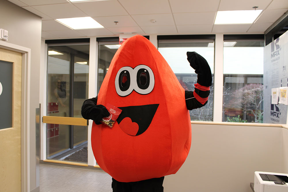 Buddy the Blood Drop mascot.