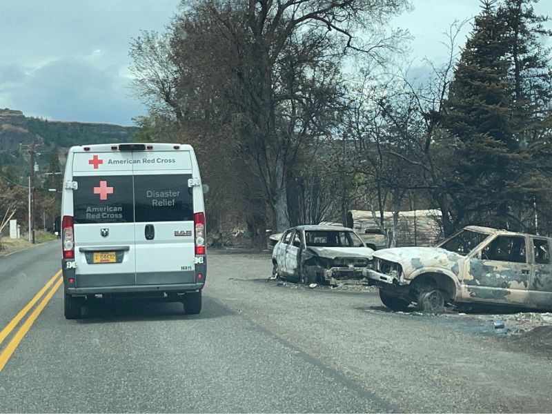 disaster relief vehicle driving down road.