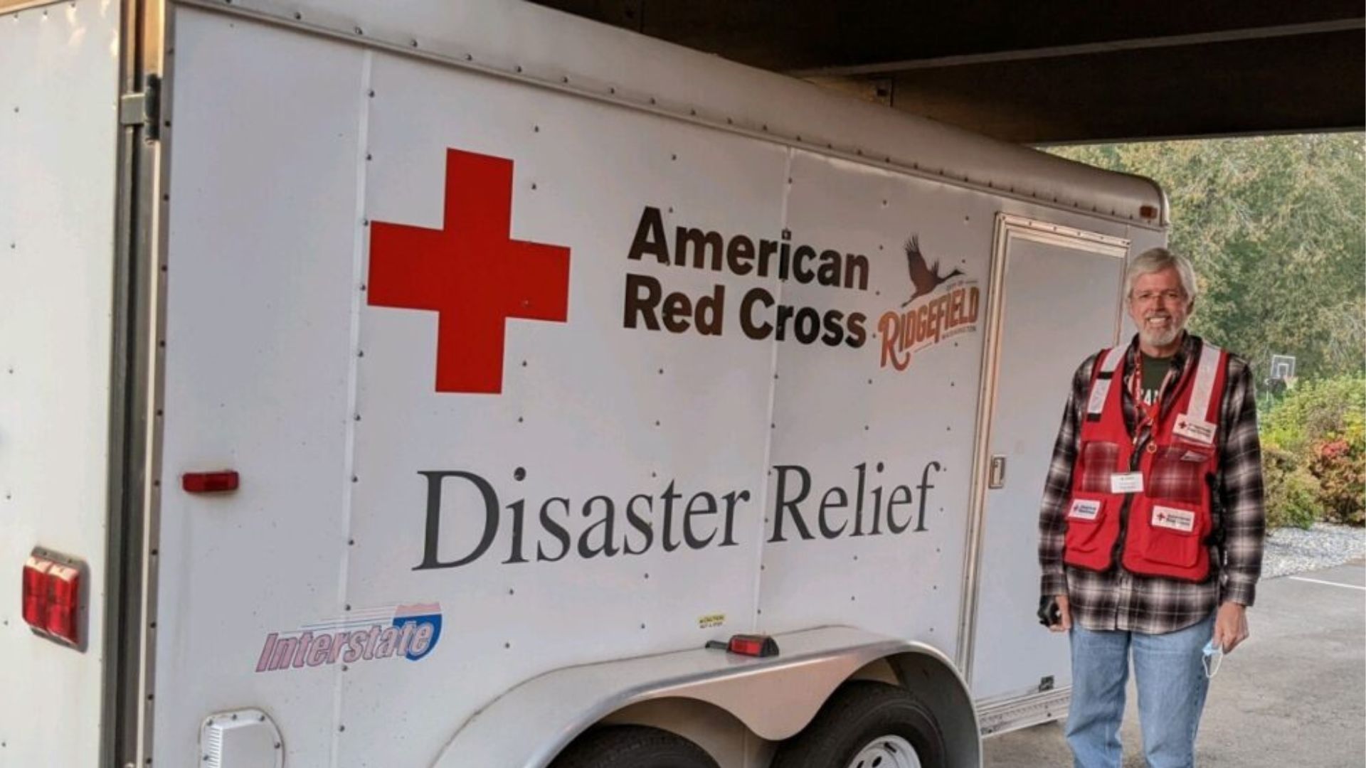 Terry Nefcy in front of disaster relief vehicle