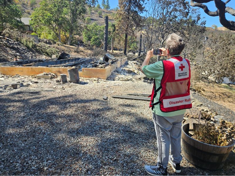 volunteer taking pictures of damage