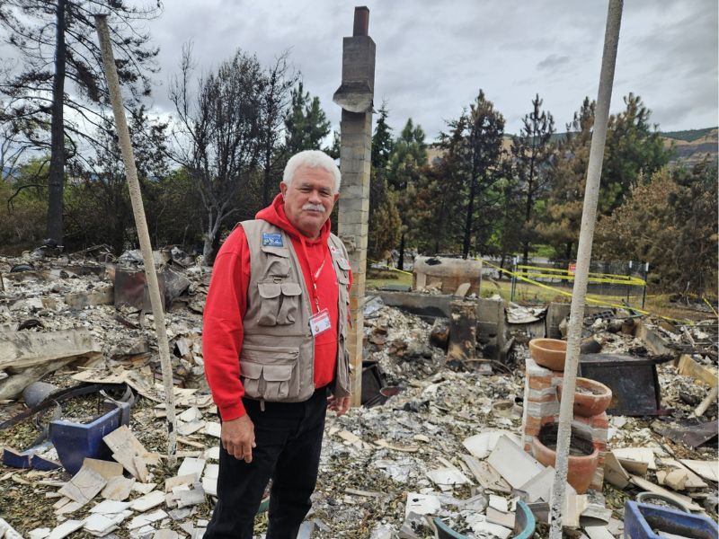 volunteer at the scene of fire damage