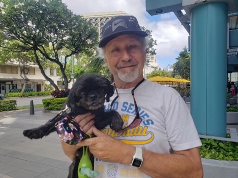 a person holding a puppy.