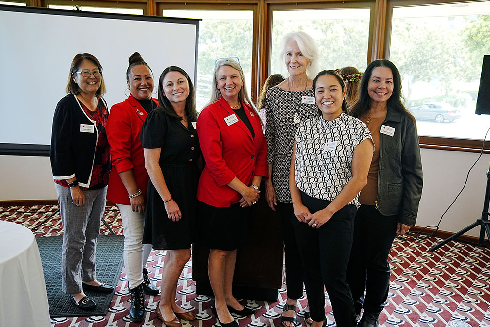 Group photo of the Red Cross PIR Staff and Board at a Red Cross event.