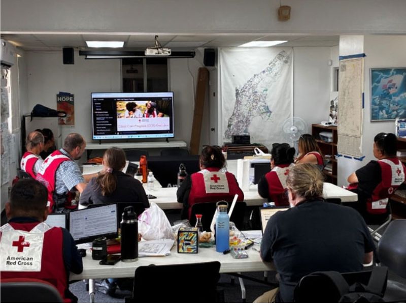 disaster volunteers view presentation in classroom