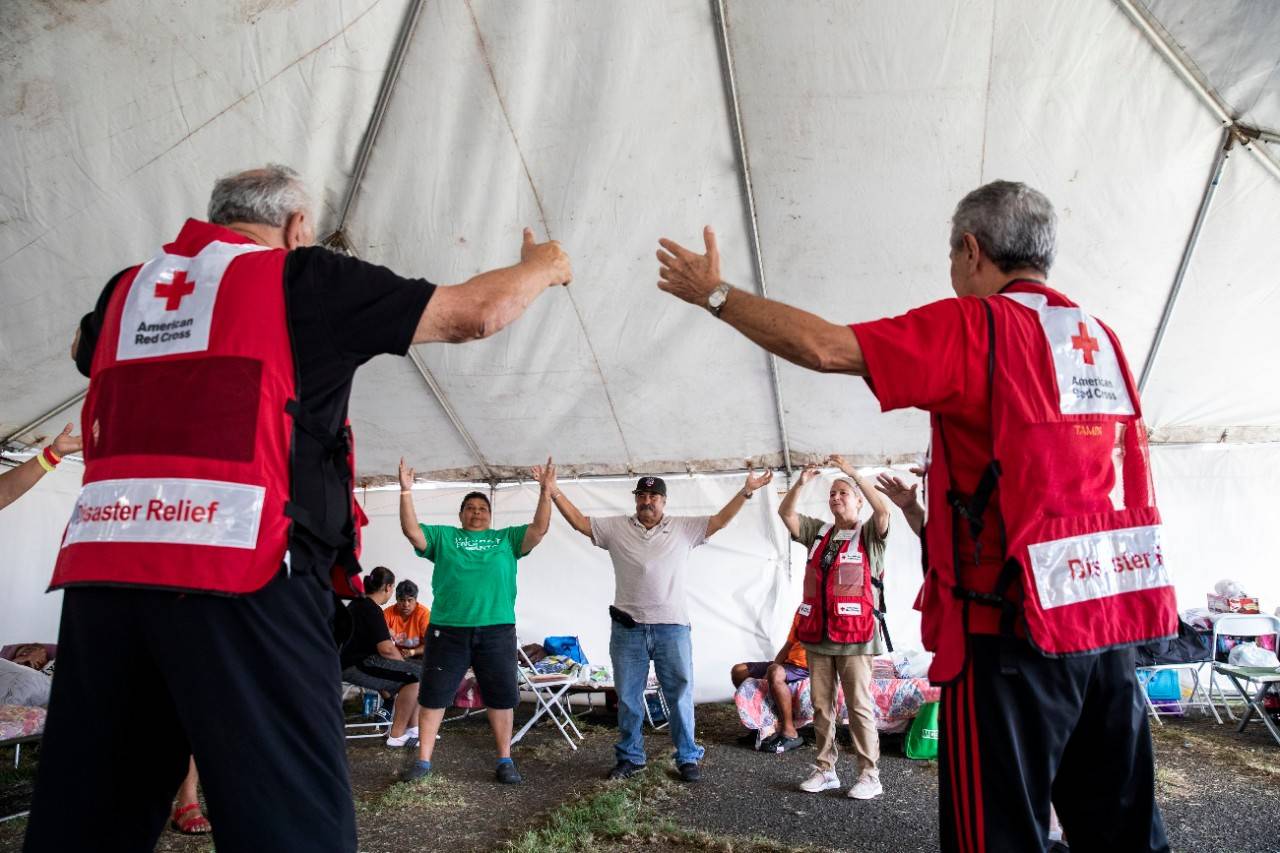 January 19, 2020. Guánica, Puerto Rico.
Red Cross volunteers lead a tai chi class that will help residents relieve stress.
Photo by Scott Dalton/American Red Cross