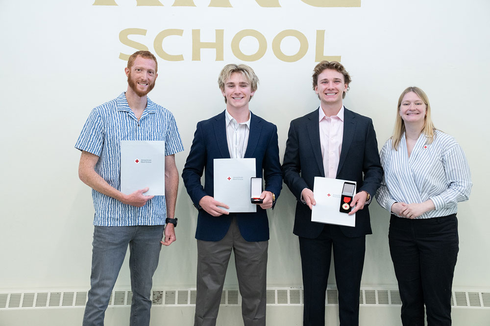 The Grayson brothers, lifeguard instructor, Hani Kinani, and Jocelyn Hillard of the American Red Cross, at the Lifesaving Award presentation.