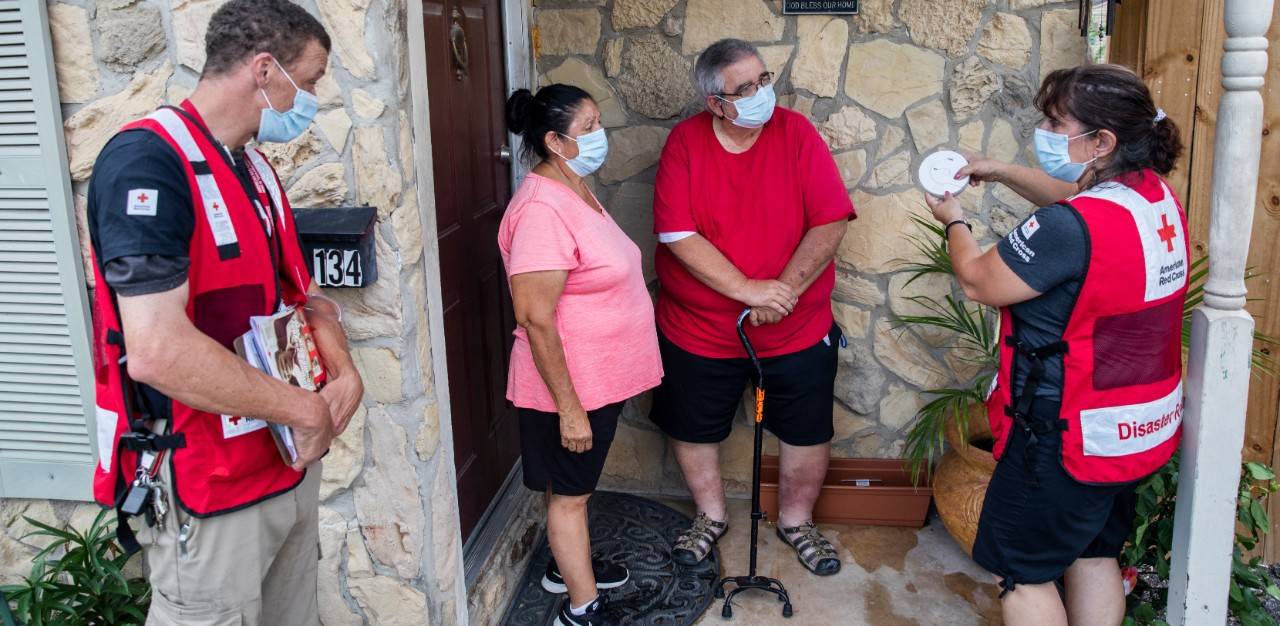 May 8, 2021. San Antonio, Texas.
Red Cross volunteers Celeste Carrola and Benjamin Quick share home fire safety information with Gerald Davis as part of the Sound the Alarm day of action on May 8, 2021.  Davis made a Sound the Alarm appointment with the Red Cross because he wanted his home to be safer.  I cannot thank you all enough for being here today,  Davis said.  It means so much. And I am going to tell my neighbors about this, so expect some calls! 
Photo by Scott Dalton/American Red Cross