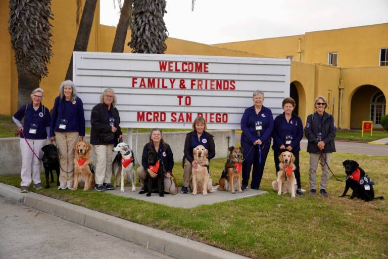 The Animal Visitation Program team including handlers and their dogs. 