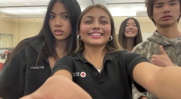 Ananya pictured alongside youth volunteers in a selfie