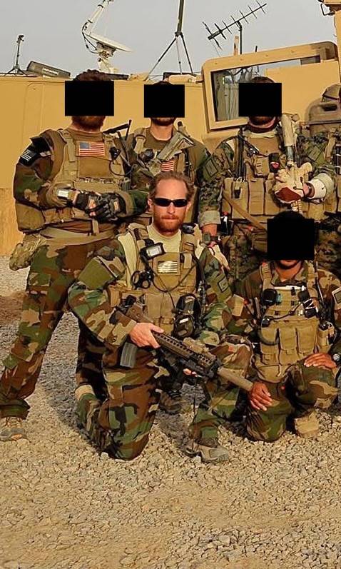 Marine Corps service members standing in desert