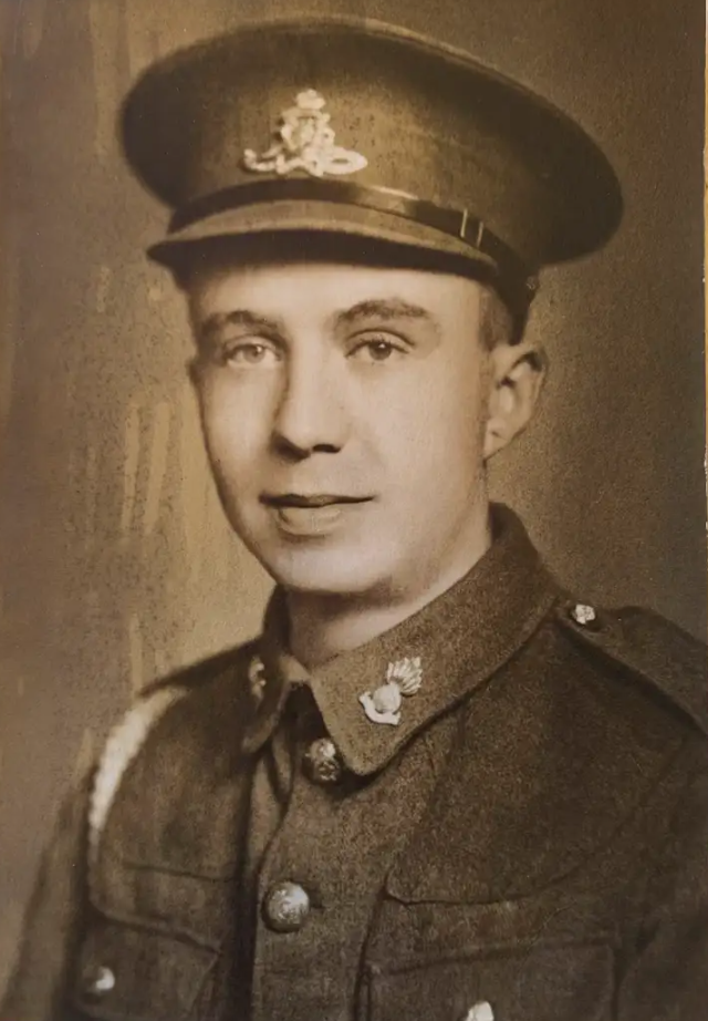 Man dressed in military uniform.
