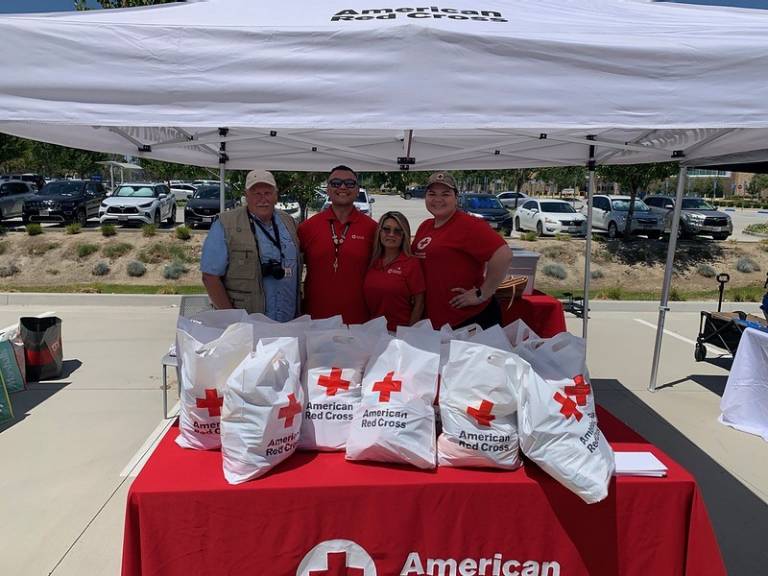 Red Cross staff pose together smiling