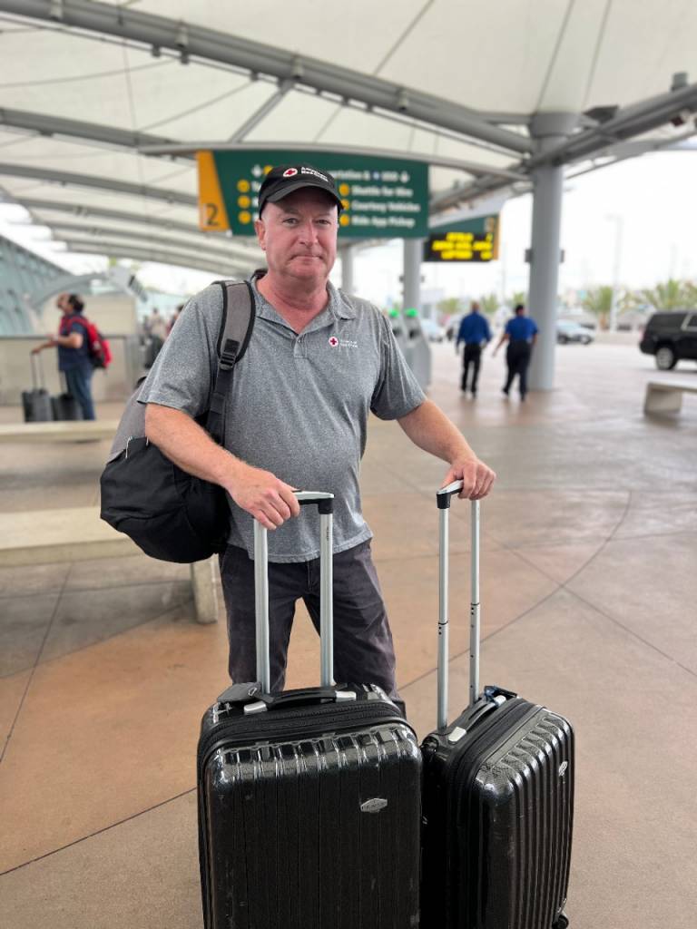 Regional CEO Sean Mahoney pictured with his luggage at the airport 