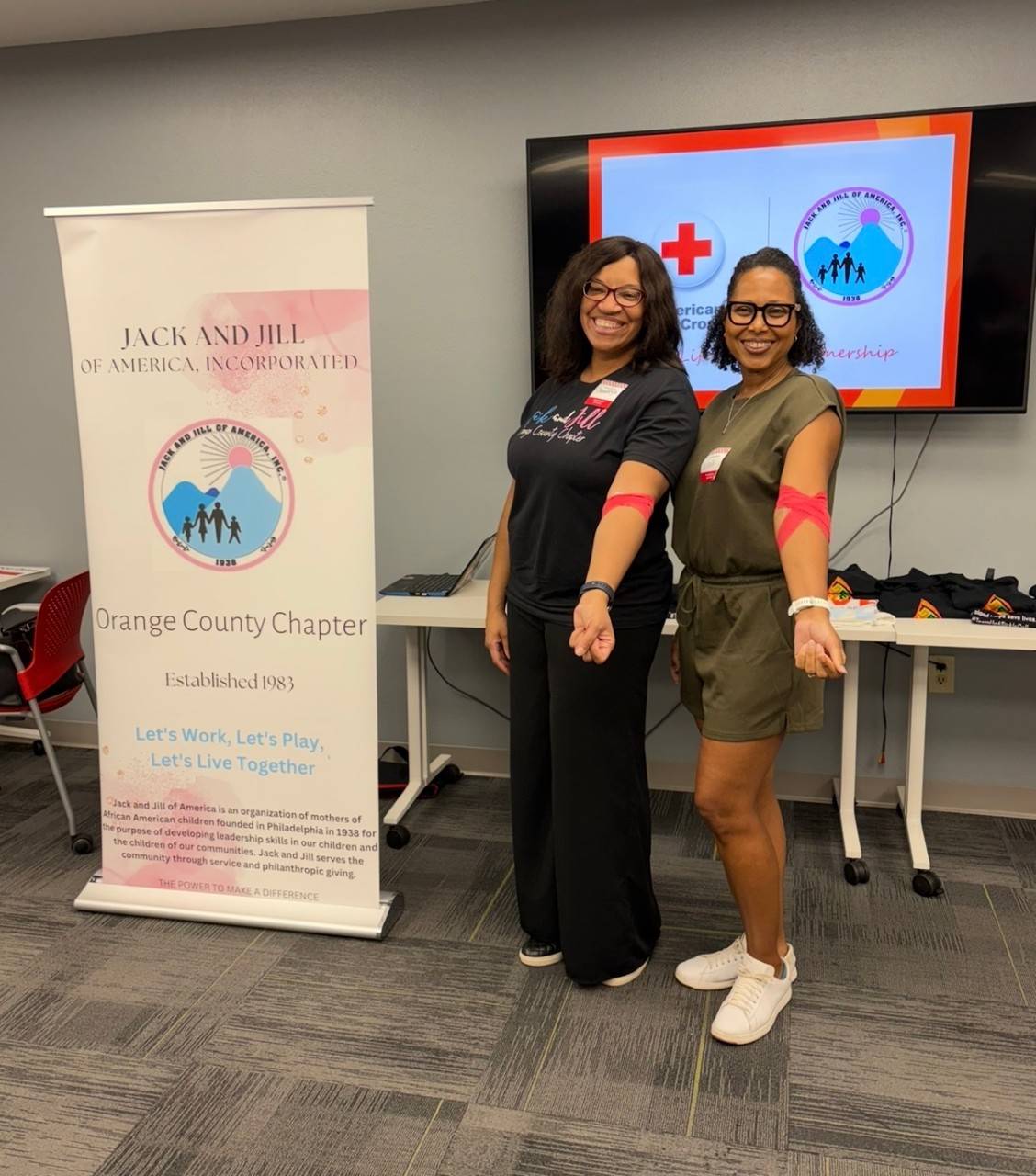 Two woman smiling after a blood donation.