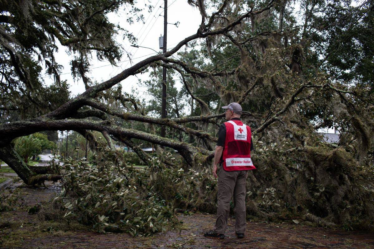 September 29, 2022. Orlando, FloridaRed Cross volunteer Dave Wagner surveys the Delaney Park neighborhood of Orlando, Fl., the morning after Hurricane Ian ravaged the state. High winds and heavy rains caused widespread property damage and dangerous conditions persisted as flood waters continued to rise.Photo by Marko Kokic/American Red Cross