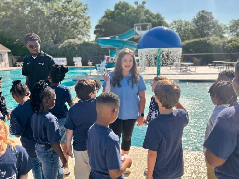 Brian and Grayce teaching students