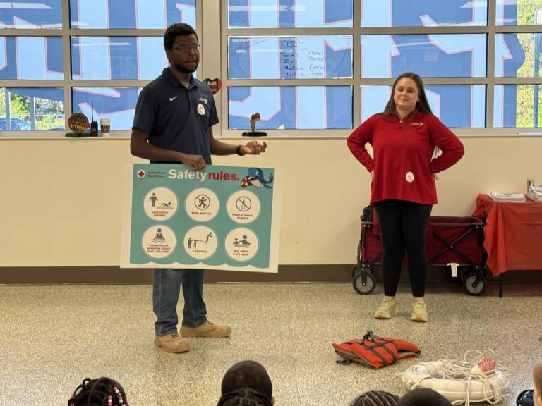 Brian and Grayce teaching students