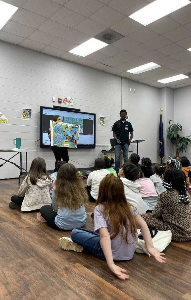 Brian and Grayce teaching students