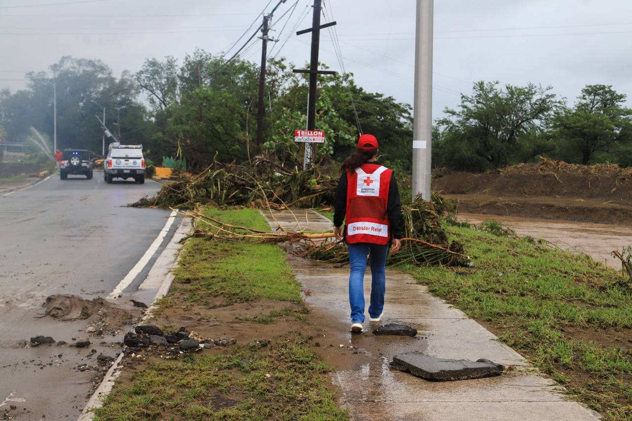 September 19, 2022. Salinas, Puerto Rico.
Red Cross employee Rosemarie Valdez observes the damages caused in roads within Salinas, Puerto Rico.
Photo by Isaac León Vales/American Red Cross