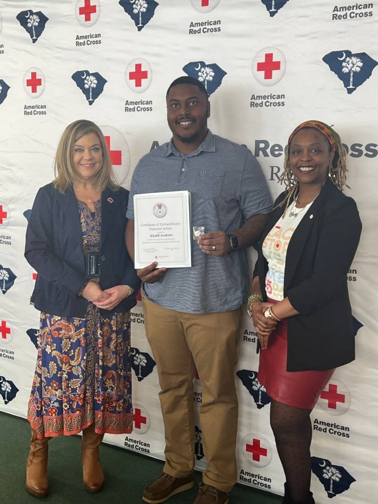 Photo of Khali Jenkins recieving lifesaving award