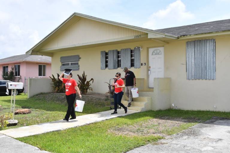 Eliza's team knocks on doors in Goulds homes. 