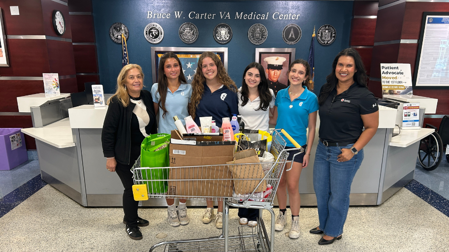 Members of the Gulliver Red Cross Youth Club deliver donated supplies to the Women’s Center at the Bruce Carter VA Medical Center in Miami.