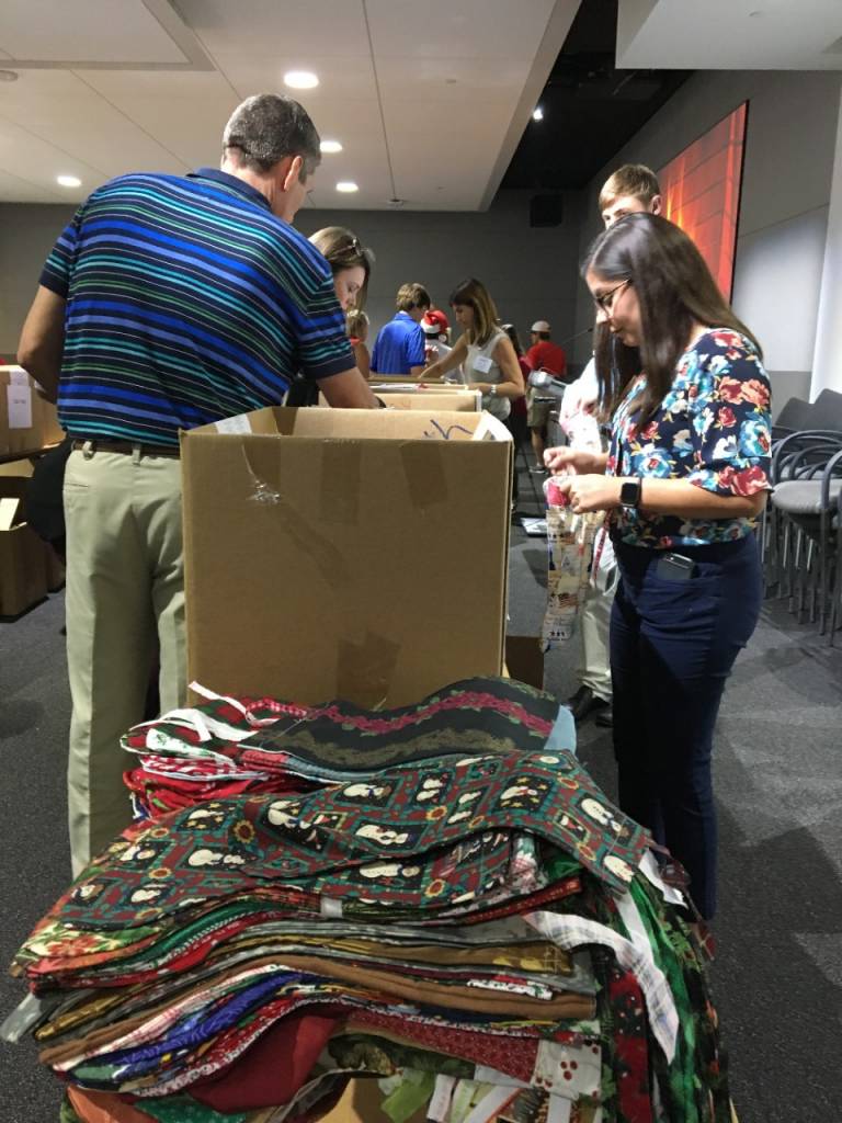 Assembly line for stuffing stockings