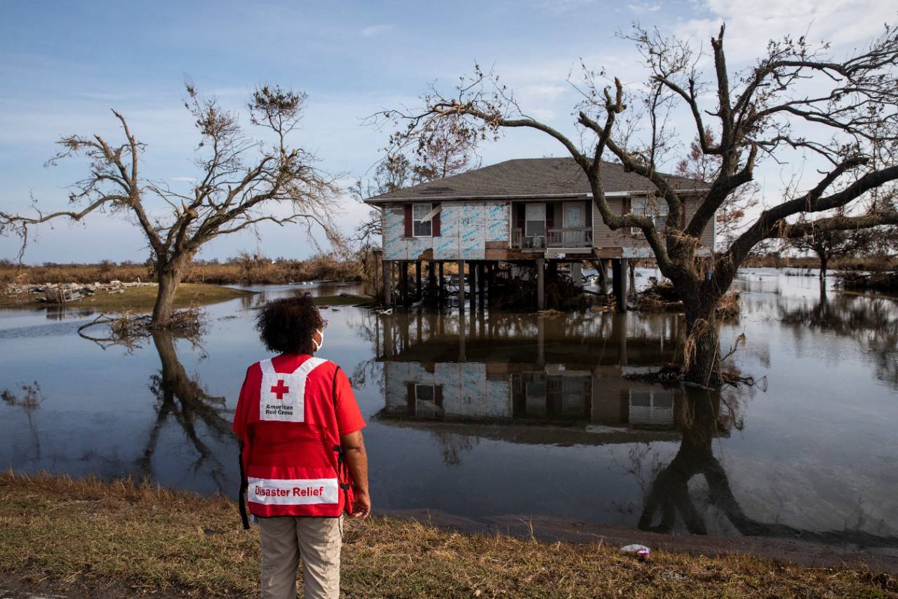 August 30, 2020. Cameron, Louisiana
Pamela Harris of the American Red Cross looks out on a home destroyed by Hurricane Laura in Cameron Parish, LA, one of the hardest hit areas, on Sunday, August 30, 2020.
Photo by Scott Dalton/American Red Cross