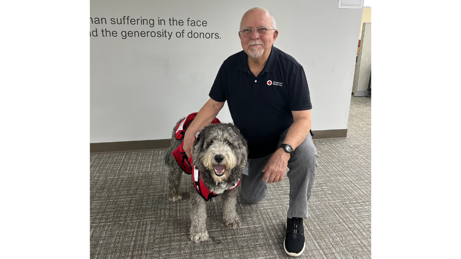 Pete Suarez and Trey, a grey dog.