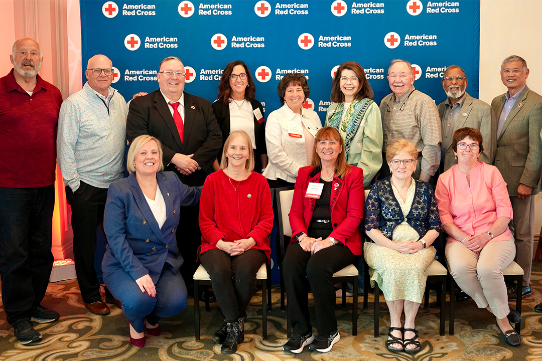 12 Red Cross volunteers who served more than 1,000 hours in FY 25 are pictured with Red Cross CEO Jennifer Graham, Delaware Valley Chapter Board Member John Susanin and Philadelphia Chapter Board Member Kenneth Wong 