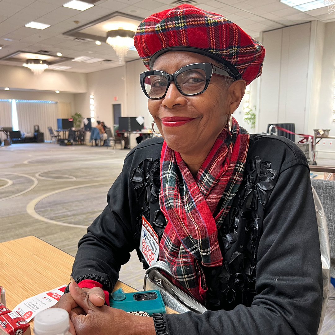 Photo of Deborah Johnson-Jennings sitting in the canteen area of a blood drive.