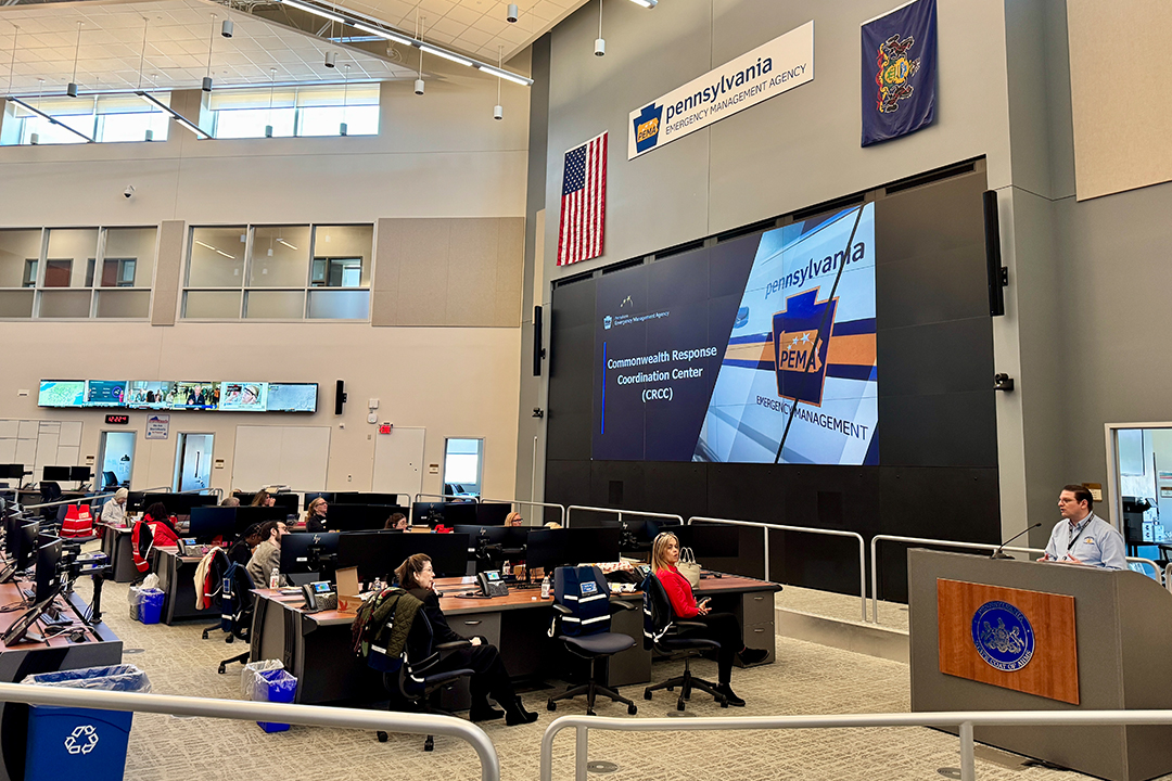 Dozens of Red Cross volunteers sit in the Emergency Operations Center in Harrisburg