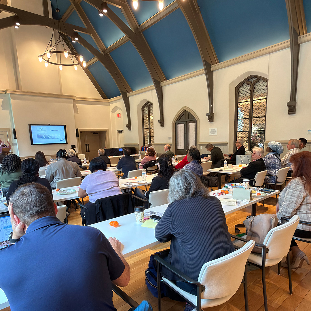 Photo of rows of Faith in Action participants seated.