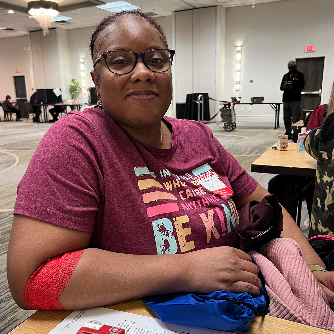 Photo of Janelle Cheeseborough in the canteen area of a blood drive.