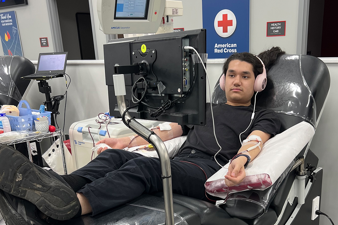 Kai Kwong donates platelets at a Red Cross Blood Donation Center.