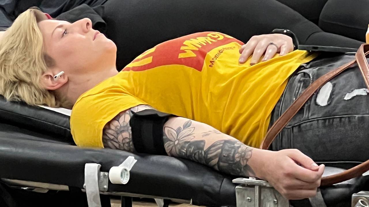 Blonde lady with tattoo donates blood