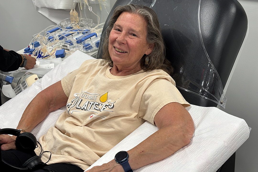 Rebecca Baranowski sits in a platelet donation chair.