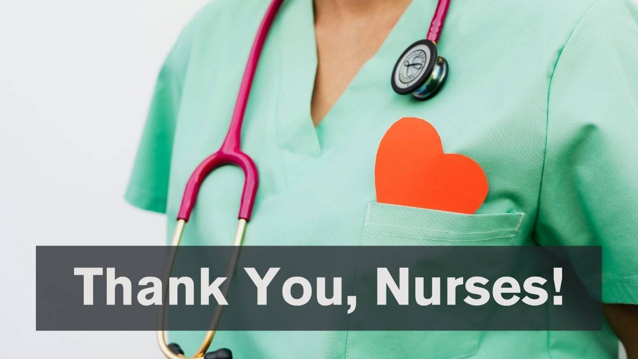 Photo of the bust of a person in medical scrubs with a stethascope around the neck and a red paper heart in the pocket with the words: Thank you nurses!