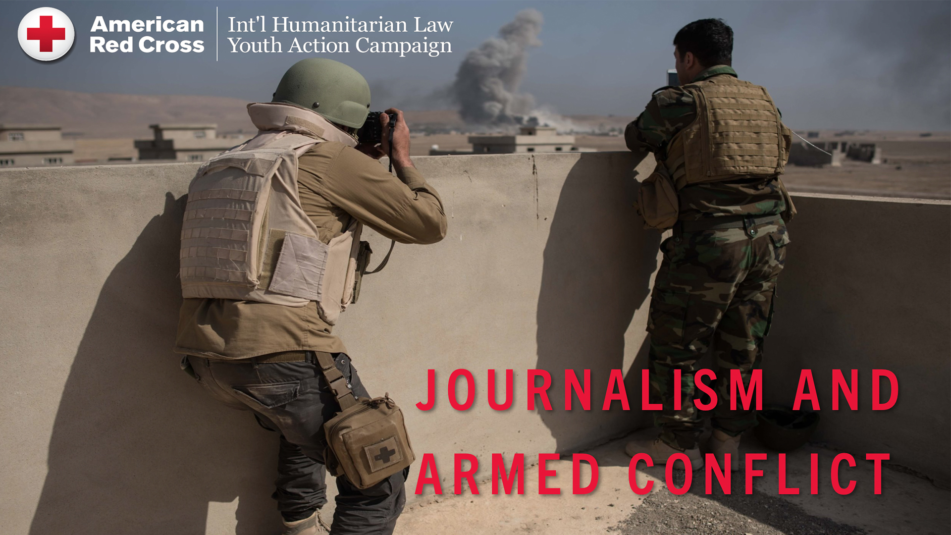 Two military journalists in combat gear photographing an explosion in the distance from behind a wall. The words Journalism and Armed Conflict" are at the bottom of the image. The Red Cross logo and the words International Humanitarian Law Youth Action Campaign are at the top. 