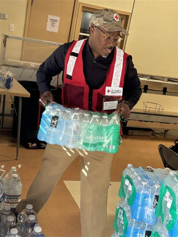 Volunteers unloading supplies