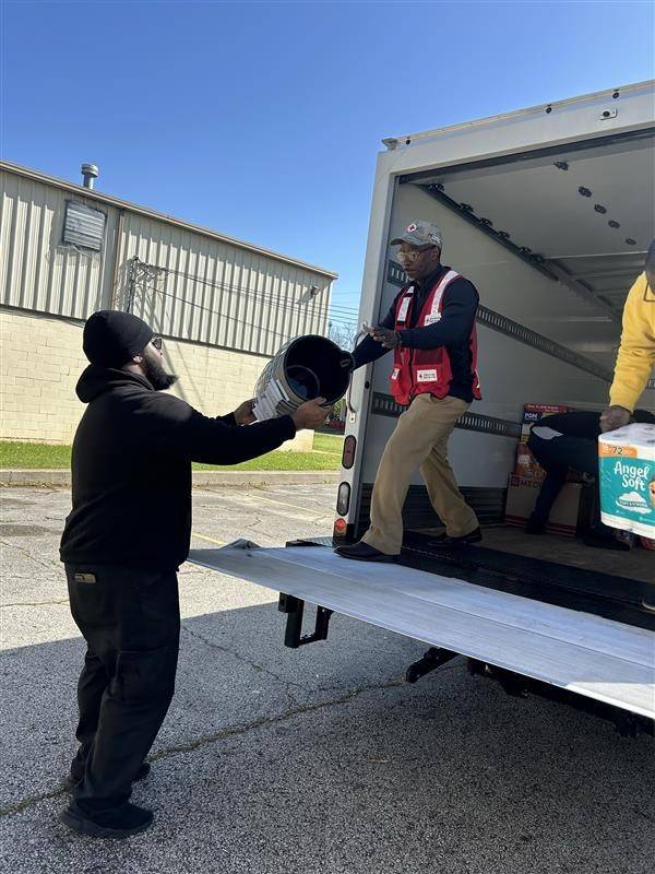 Volunteers unloading truck