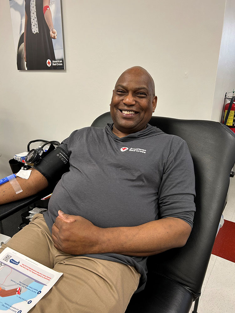 Gary Jamison, sitting in a chair and smiling, while donating blood at the American Red Cross Blood, Plasma and Platelet Donation Center in Nashville, Tennessee.
