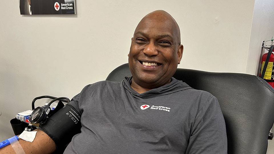Gary Jamison, sitting in a chair and smiling, while donating blood at the American Red Cross Blood, Plasma and Platelet Donation Center in Nashville, Tennessee.