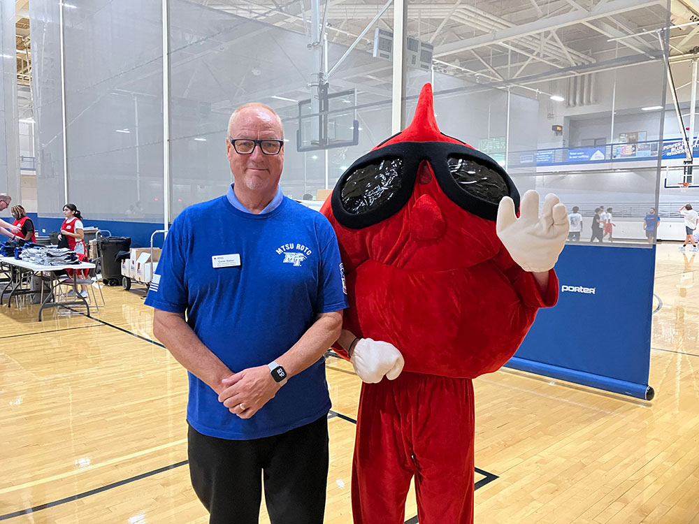 Gene with Buddy the Blood Drop at Middle Tennessee State University during a blood drive.